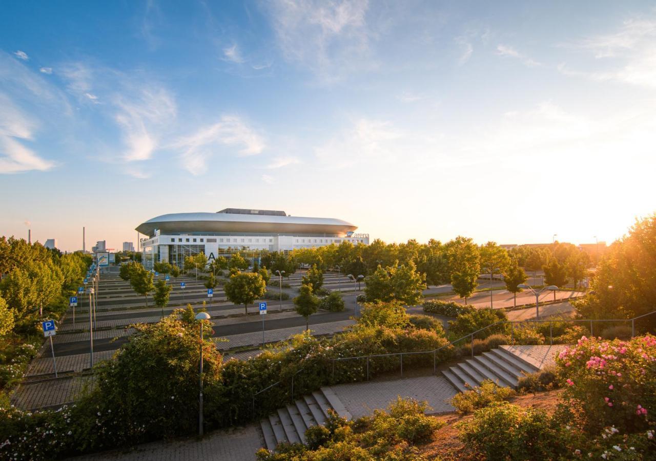 Hostel MHG Exteriör bild The stadium at sunset