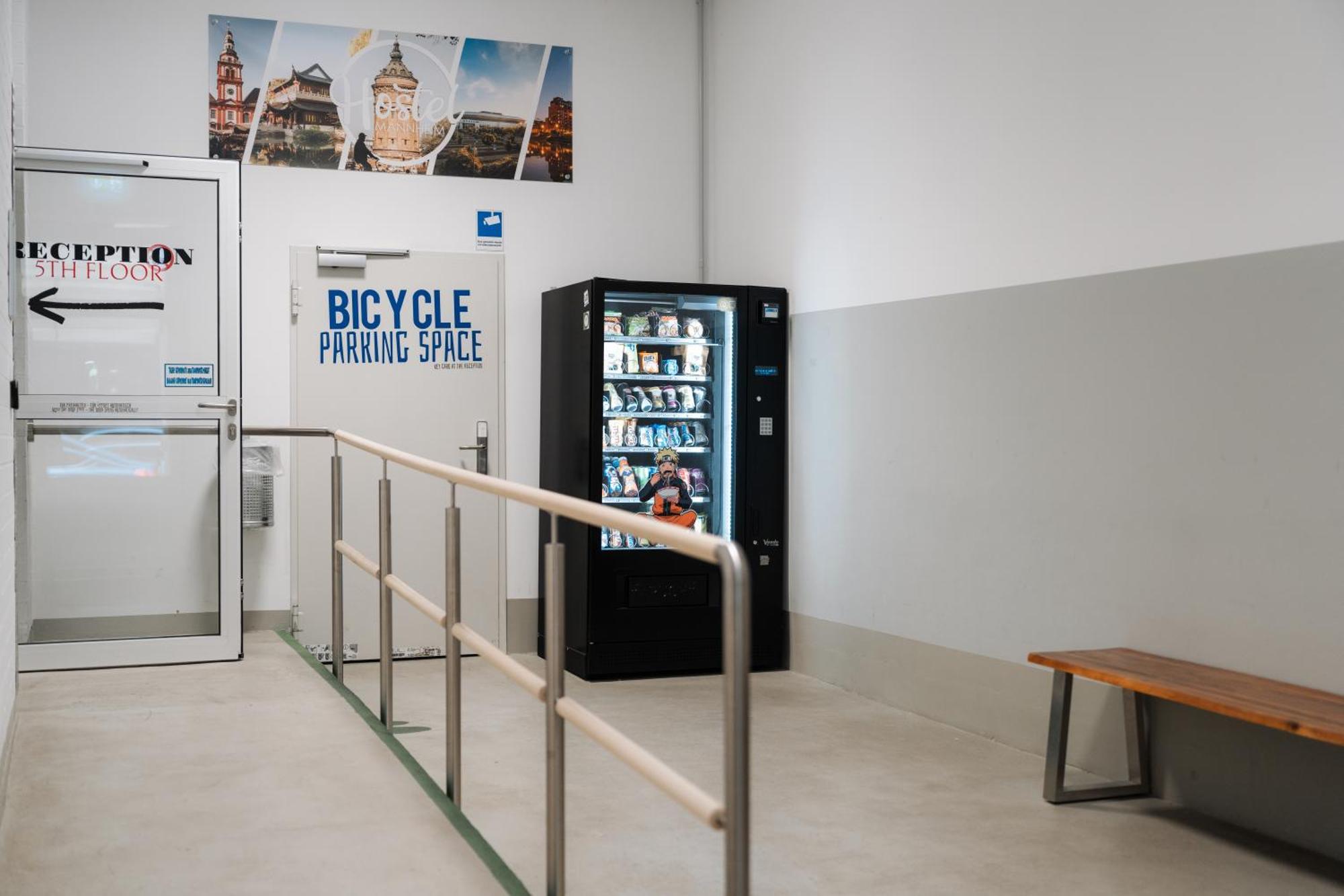 Hostel MHG Exteriör bild A vending machine in a bicycle parking garage